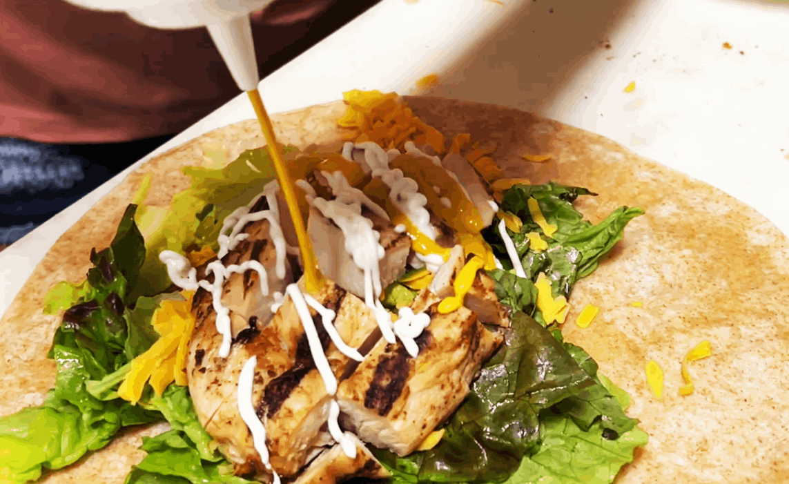 coffee n creams gilled chicken wrap sandwich with lectus and mayo and mustard
